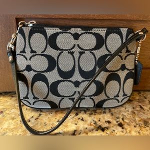 Coach signature collection grey and black wristlet, baby blue interior.